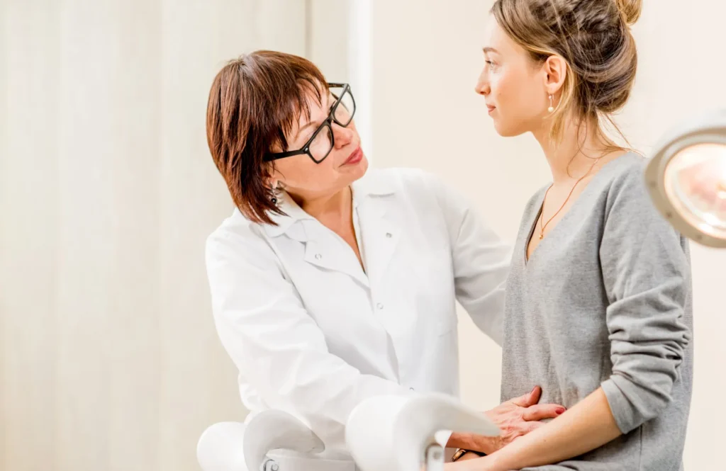 Woman getting examined by doctor