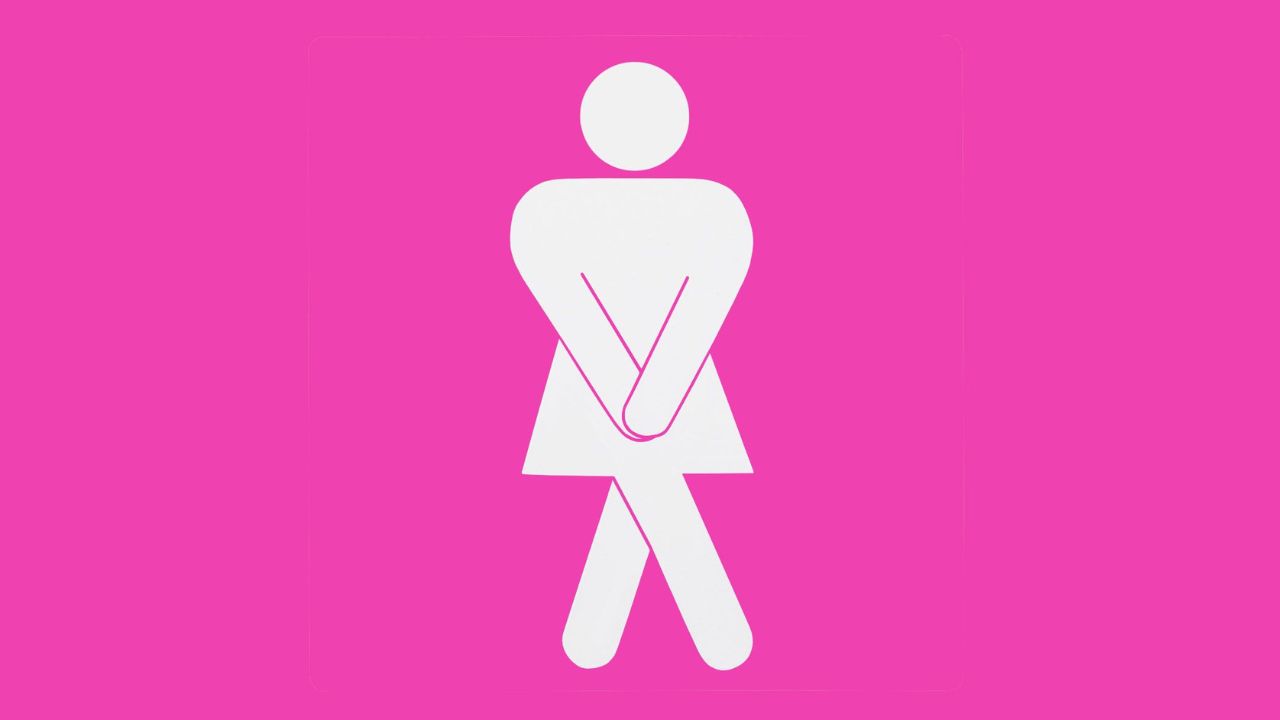 Pink woman's bathroom sign that has to pee