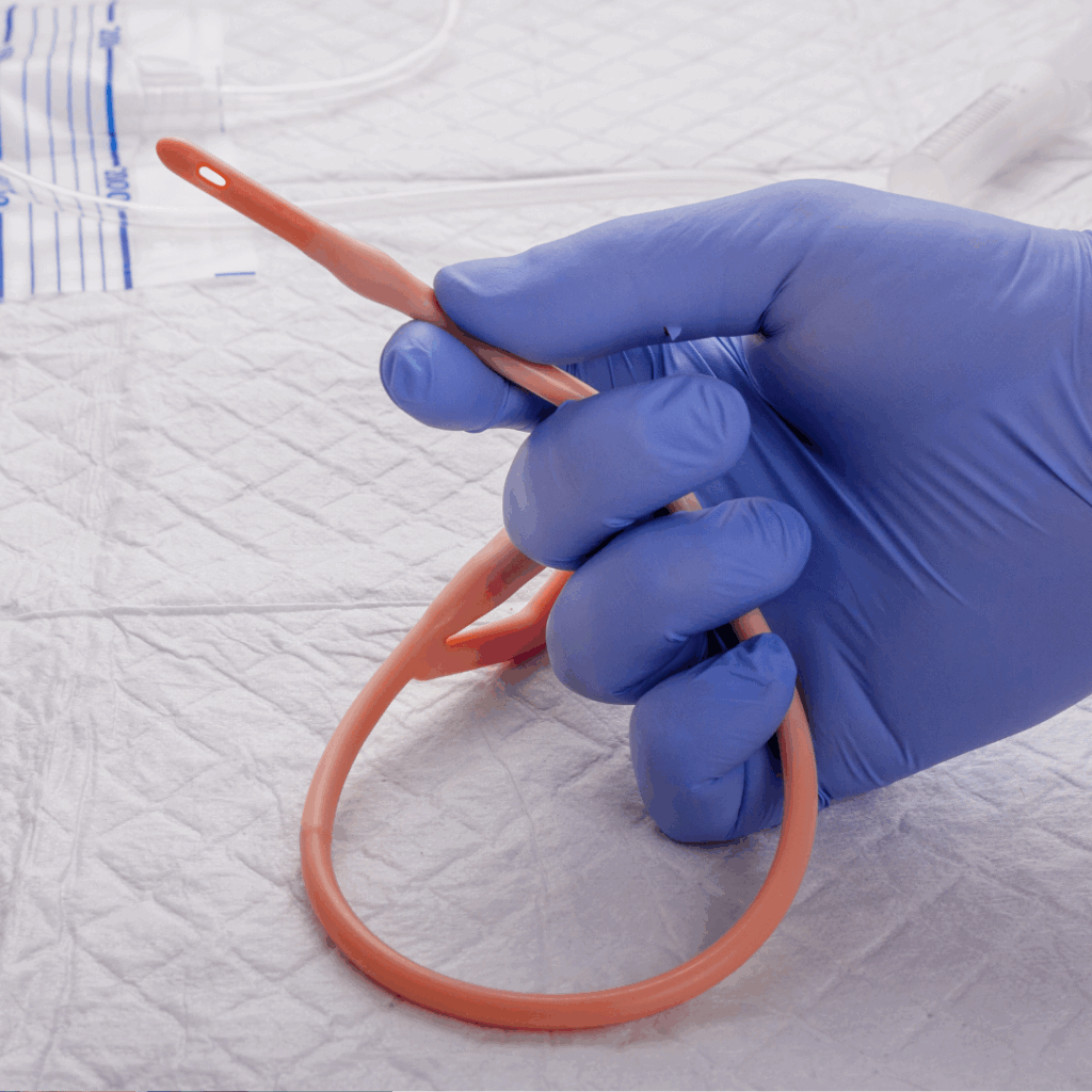 urinary catheter in gloved hand